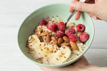 Healthy vegan breakfast, oatmeal with berries and nuts