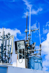 Telecommunication antennas and wireless communication antenna transmitter against the blue sky