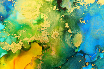 art photography of abstract fluid art painting with alcohol ink, blue, green, yellow and gold colors
