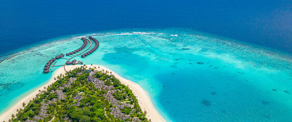 Wonderful aerial view landscape, luxury tropical resort or hotel with water villas and beautiful...
