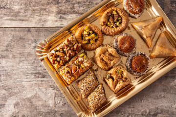 Assortment of Ramadan dessert baklava on wooden table