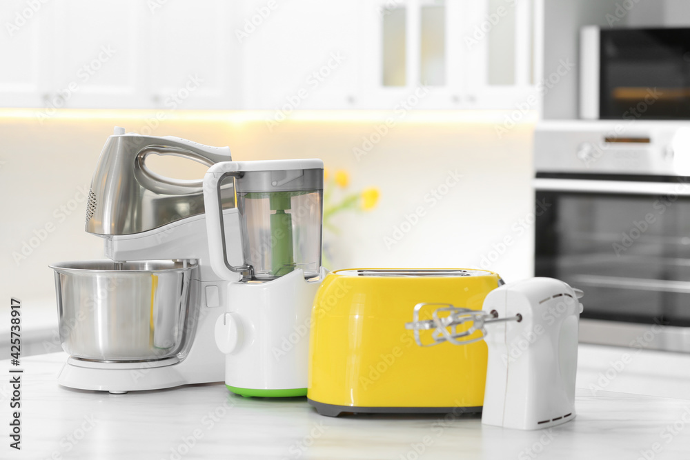 Poster Modern toaster and other cooking appliances on table in kitchen