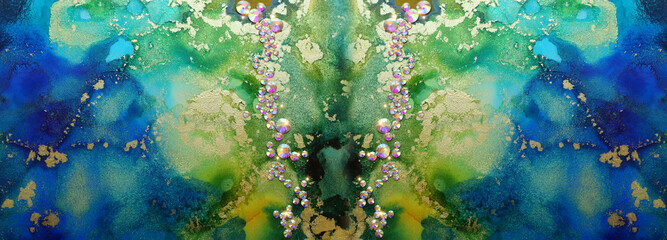 art photography of abstract fluid art painting with alcohol ink blue, green, gold colors and crystal rhinestones