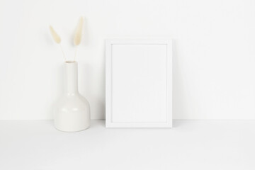 Small white photo frame mockup with white vase