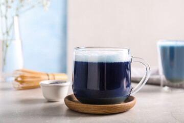 Obraz na płótnie Canvas Delicious blue matcha drink on light grey table