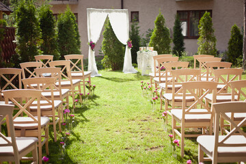 Wedding set up in a garden. Wedding ceremony & Wedding decorations/Wedding Archway/Wedding Archway with peony decorations
