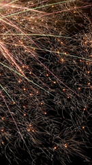 Beautiful bright fireworks lighting up night sky