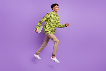 Full length body size of young jumping high running on meeting with laptop isolated on pastel purple color background