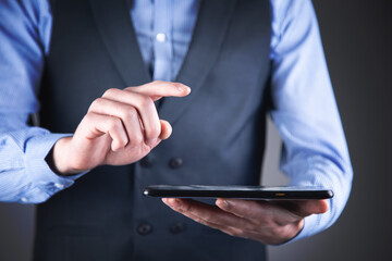 man holding digital tablet device in hands