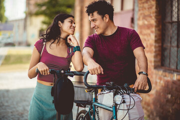 Couple talking on street.