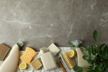 Cleaning concept with eco friendly cleaning tools on gray textured table