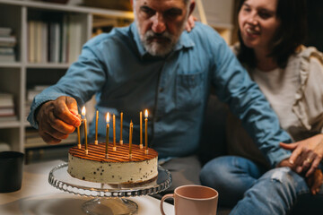 middle aged couple celebrating anniversary at home