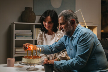 middle aged couple celebrating anniversary at home