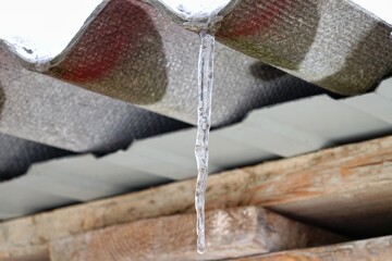 Icicle on the roof of a timber warehouse
