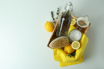 Cleaning concept with eco friendly cleaning tools and lemons on white background