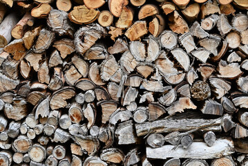 A close up of a well-stocked woodpile, ready for a cold winter