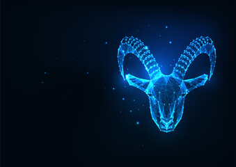 Futuristic glowing low polygonal goat, mouflon protrait, capricorn isolated on dark blue