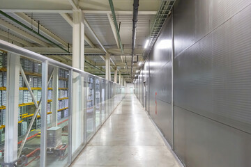 Fototapeta premium Inside the building of the Moscow Brewing Company plant. Long empty corridor in a modern industrial production area. Mytishchi, Russia