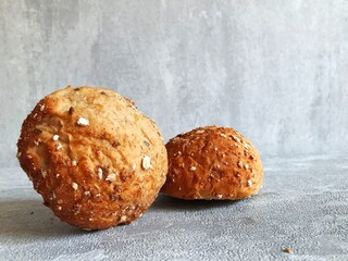 freshly baked rye buns and on the table.