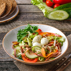 Salad with eggs, beef tongue and vegetables.