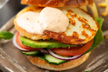Halloumi cheese Burger with french fries. vegetarian food