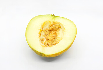 Cut melon with seeds isolated on white background