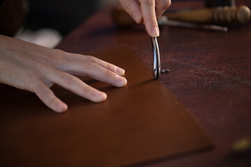 Tailor leather work crafts craftsmen manual work Shoemaker Saddler - obrazy, fototapety, plakaty