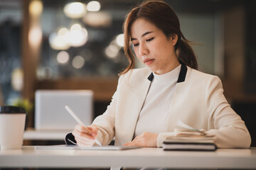 Fototapeta premium Young Business woman working about target or planning of company, tax, accounting, report,statistics and analytic research,investment concept
