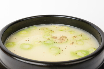 Beef bone broth on a white background
