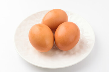 Yellow egg on white background