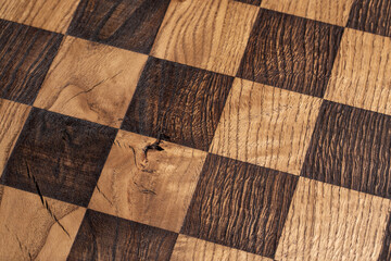Solid Oak wood chess board from above, close up