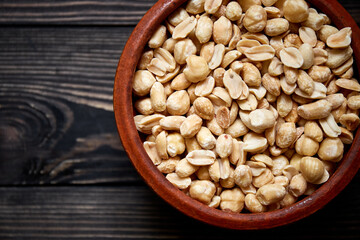 Nuts bowl on wooden background. Healthy vegan food.