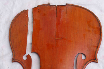 Broken antique violin parts for restoration with damage  © Mikalai
