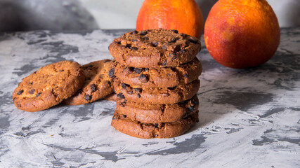 Cookies with chocolate orange icing, on a white and black background, copy space, template