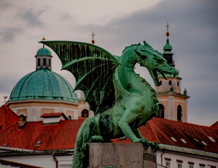 Fototapeta na wymiar Dragon statue on Dragon Bridge, Ljubljana, Central Slovenia Region