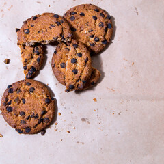 Cookies with chocolate icing, on gray packaging paper, copy space, template