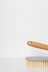 Wooden brush for cleaning on a white background.