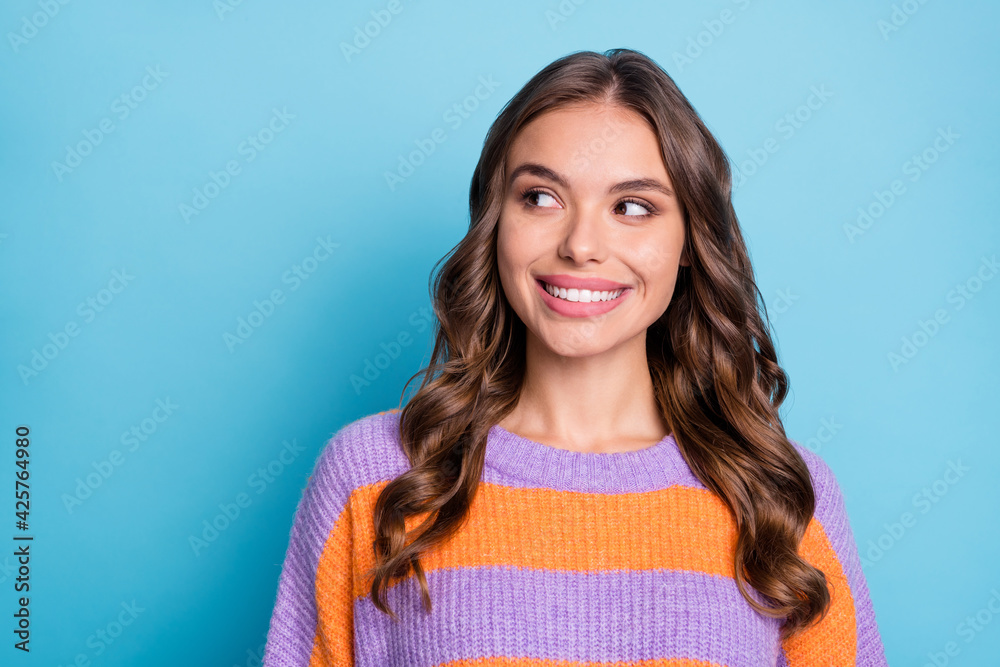 Poster photo of minded lady look side empty space toothy beaming smile wear striped sweater isolated blue b