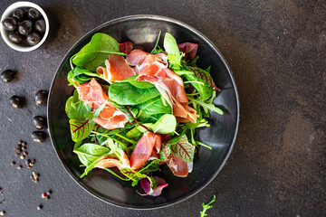 salad vegetable jamon prosciutto green leaves mix lettuce olives ham meat snack healthy meal top view copy space food background 