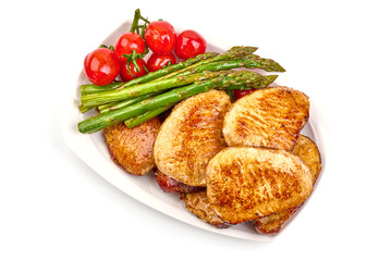 Grilled pork steaks with asparagus, isolated on white background. High resolution image