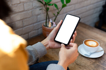 cell phone blank white screen mockup.woman hand holding texting using mobile on desk at office.background empty space for advertise.work people contact marketing business,technology