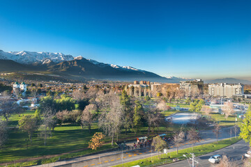 View of Los Dominicos Park and neighborhood with Los Andes Mountain Range as a backdrop in Las Condes district, Santiago de Chile