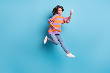 Fototapeta na wymiar Full length body size view of charming crazy cheerful girl jumping fooling having fun isolated over bright blue color background