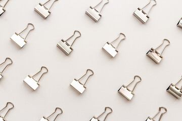 Paper binder clips pattern, copy space. Office supplies background