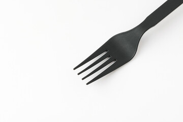 Plastic fork on white background