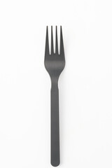 Plastic fork on white background