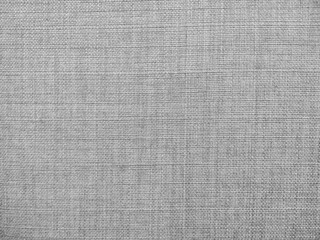 Selective focus of gray textured fabric. Macro shot of gray upholstery for furniture. Wallpaper and...