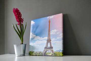 Canvas print stretched on frame with gallery wrap on grey wall background. Photography with Paris...