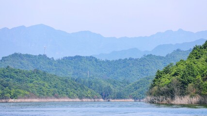 Fototapeta na wymiar lake with mountains and blue sky