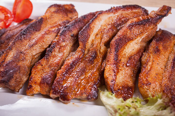 Close up of delicious boned ribs served on table
